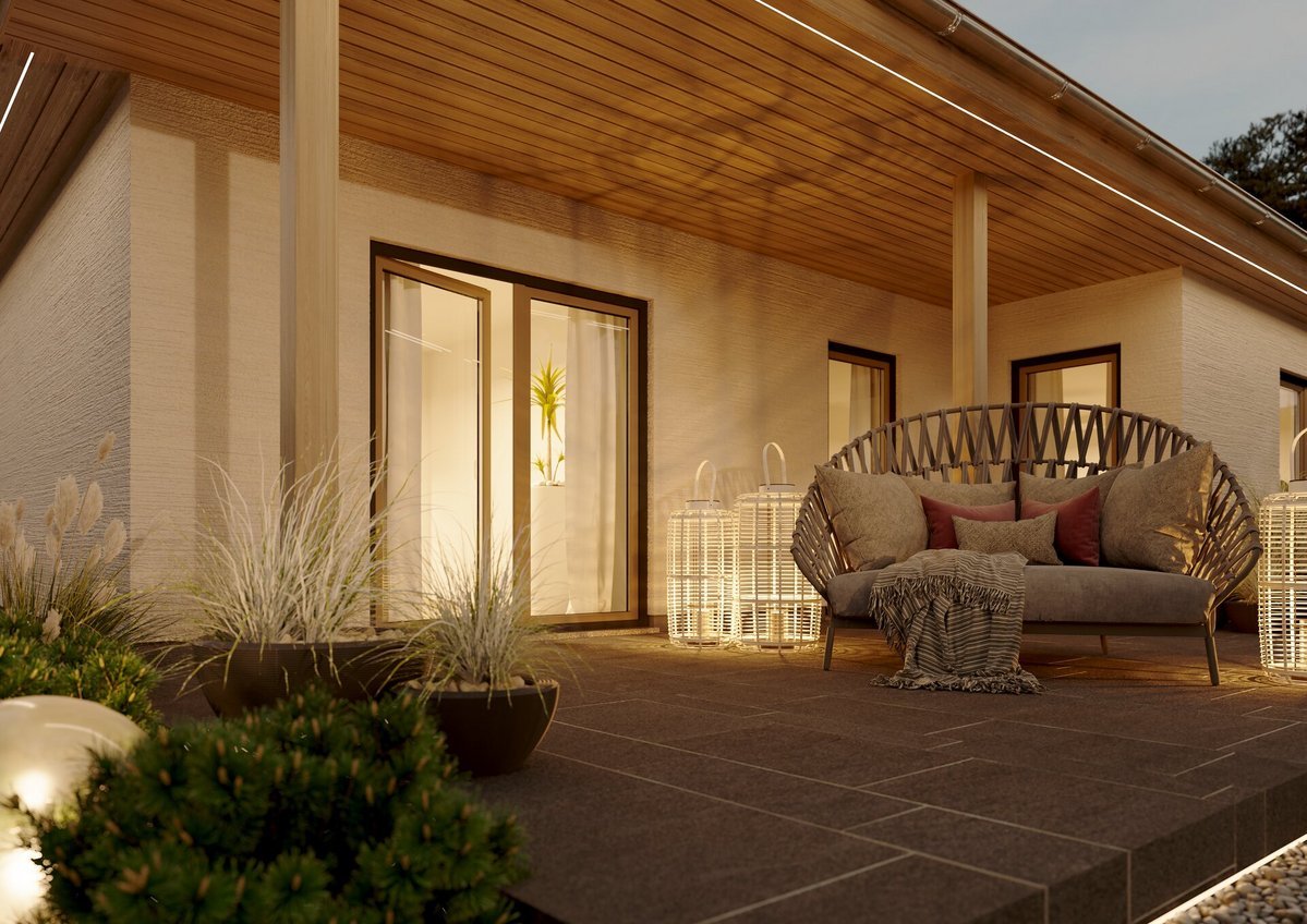 Moderner Bungalow mit Garten in warmer Abendstimmung